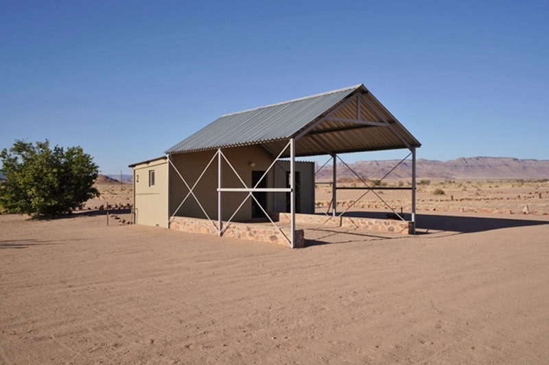 Roof structure and private bathroom at Little Sossus Camping Sesriem